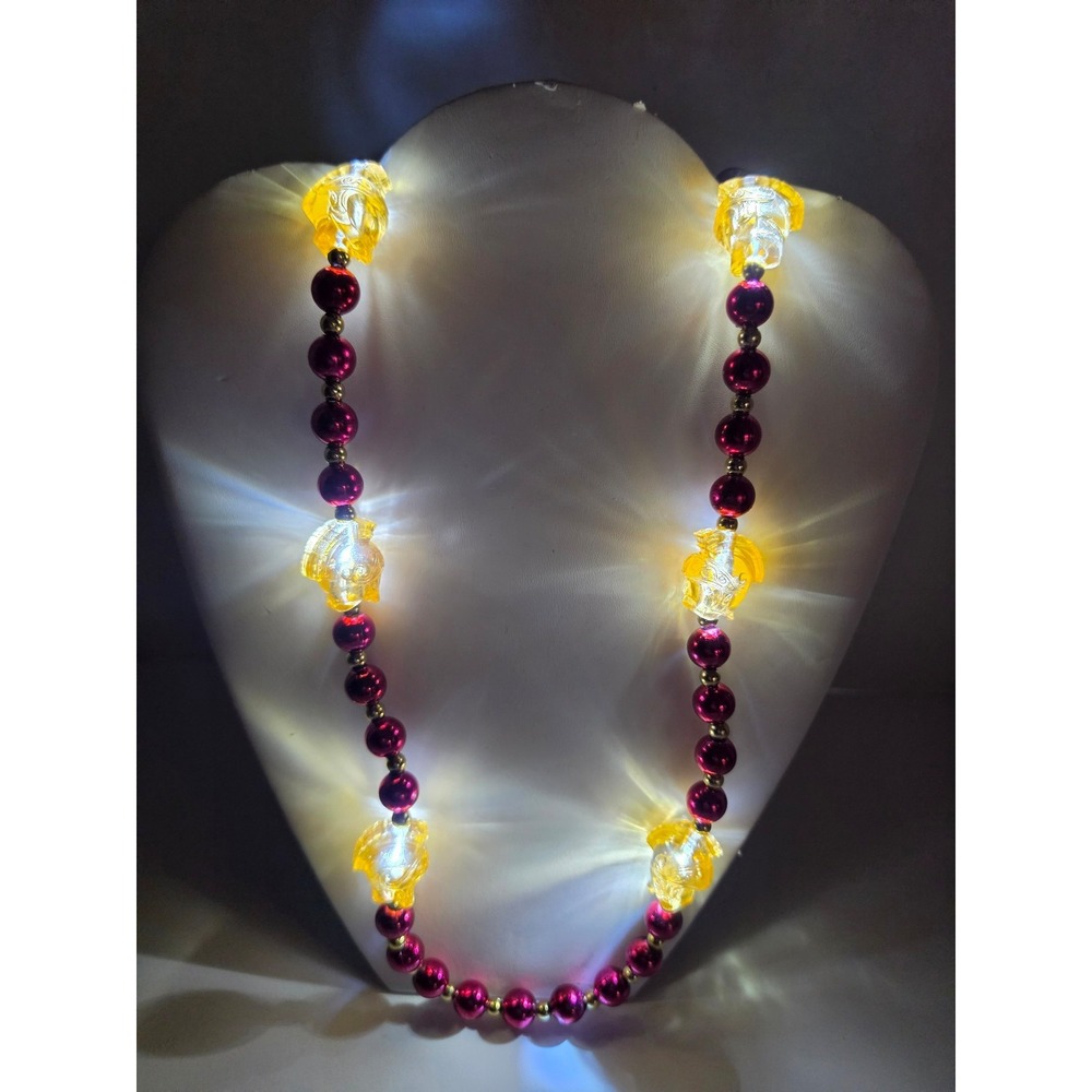 Orpheus specialty Mardi Gras beads featuring LED-lit lyre charms